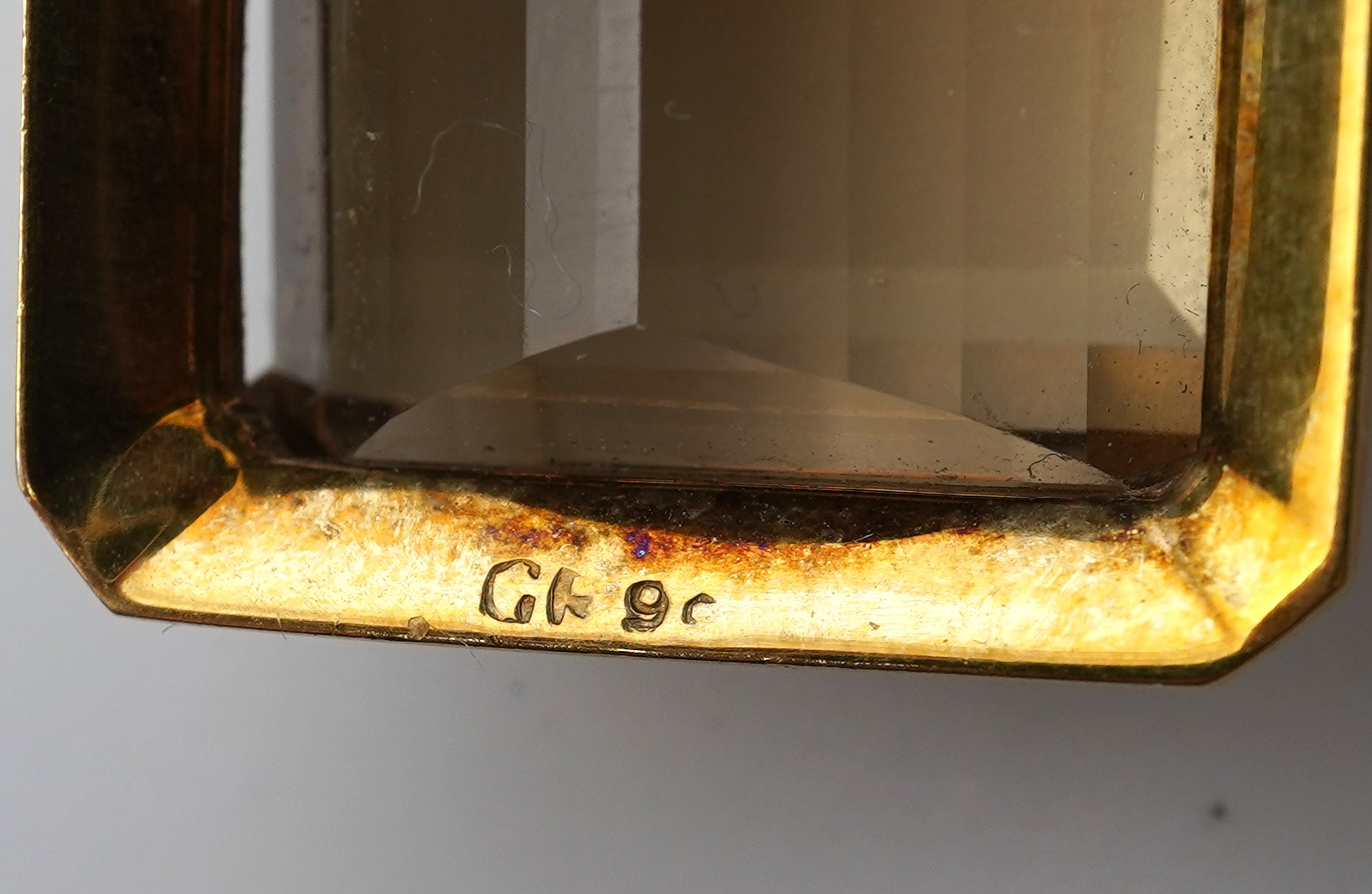 A citrine brooch and pendant, and onyx stickpin